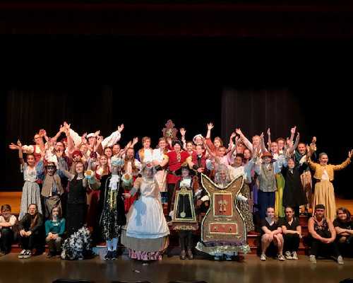 middle school drama club poses for photo.