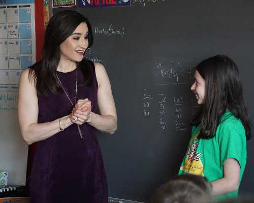 Two girls give a presentation.
