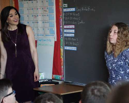speaker and student give a presentation.